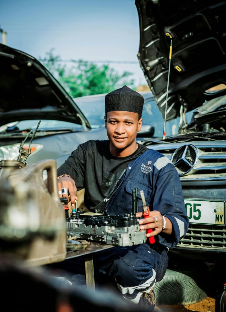A mechanic working on a vehicle