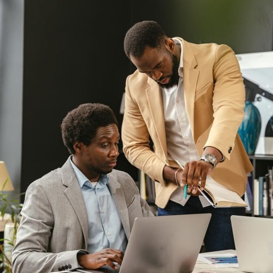 Finance professionals offering assistance to a client